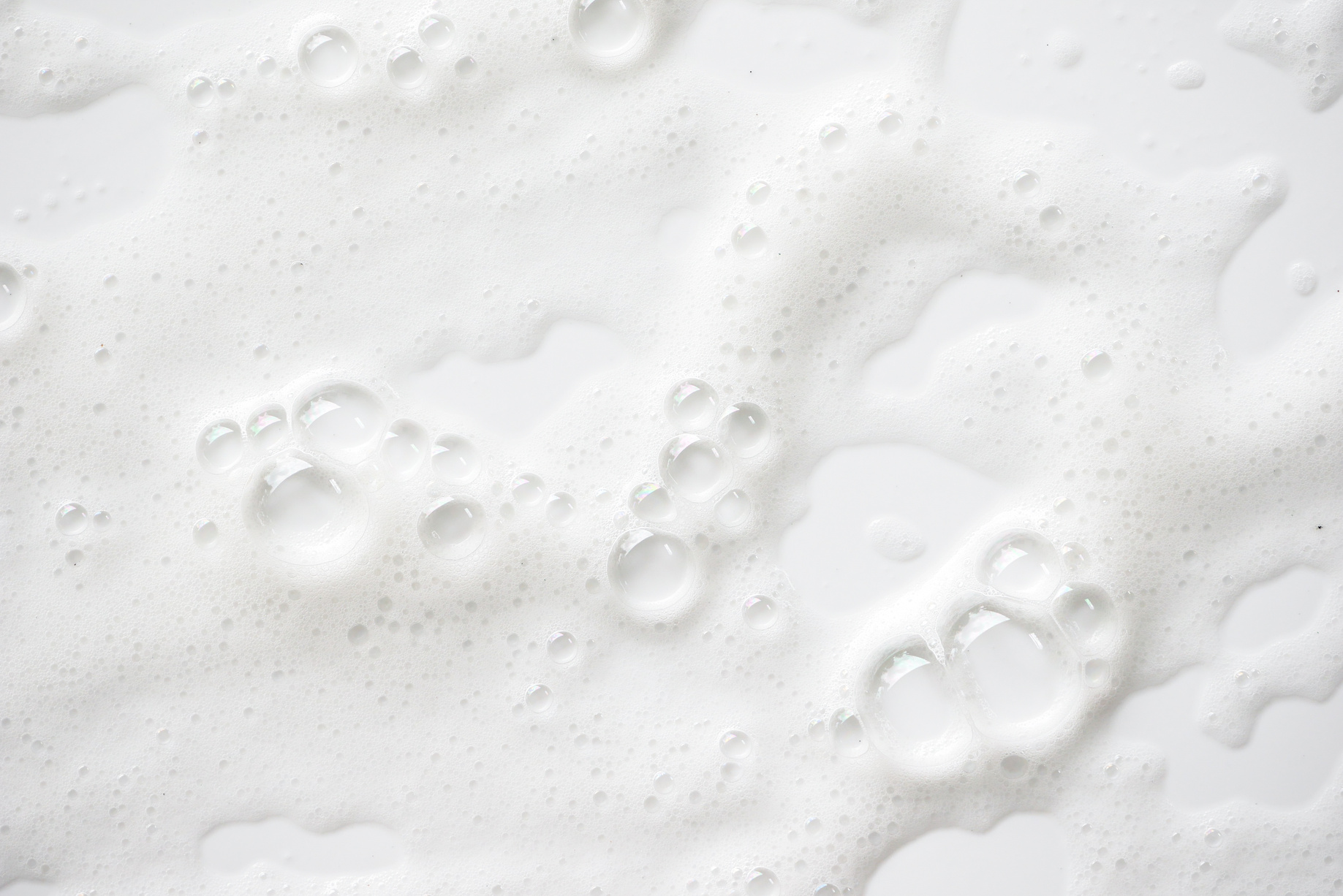 Abstract background white soapy foam texture. Shampoo foam with bubbles